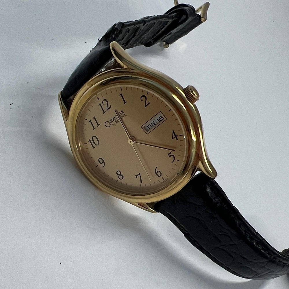 Caravelle by Bulova Vintage Quarts Watch Day Date Second Hand Function